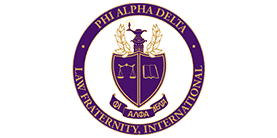 Logo of the Phi Alpha Delta Law Fraternity International with a purple and gold shield containing symbols representing the fraternity. - Maines Legal